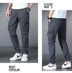 Men's dark gray cargo jogger pants with multi-pockets and drawstring waist detail