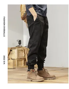 Men's retro Japanese style black cargo pants with elastic waistband and tapered leg
