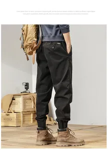Detailed back view of men's Japanese retro cargo joggers in black with elastic cuffs.