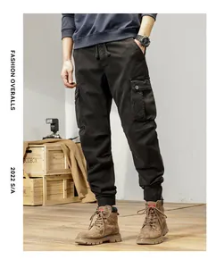 Detailed view of men's vintage black cargo jogger pants with functional side pockets
