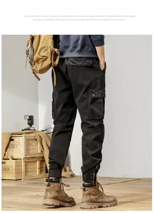 Back view detail of men's retro black cargo pants with tapered cuffs and utility pockets
