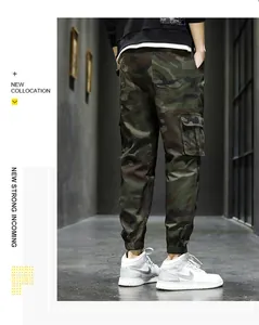 Detailed view of men's camouflage cargo joggers with multi-pocket design