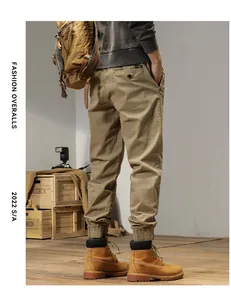 Back view of men's retro khaki cargo pants with elastic cuffs and outdoor style.