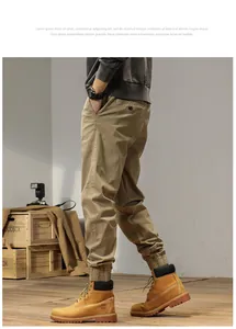 Men's khaki cargo joggers featuring elastic cuffs and a vintage outdoor utility style