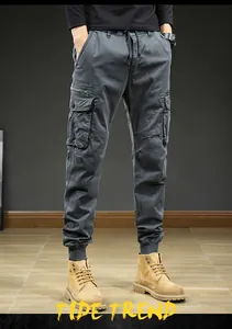Detailed front view of men's vintage grey multi-pocket cargo jogger pants with cuffs