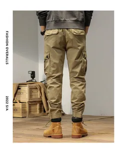 Close-up rear view of khaki cargo pants showing pocket details, jogger cuffs and vintage fit