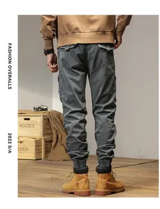 Detailed rear view of men's vintage charcoal gray cargo pants featuring multi-pocket design