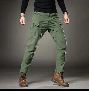 Close-up view of men's slim fit army green cargo pants featuring tactical multi-pockets