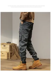 Detailed side view of men's retro cargo pants with multi-pockets and elastic cuffs.