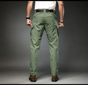 Rear view of army green men's multi-pocket tactical cargo pants with elastic fit