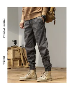 Macro view of grey Japanese style retro cargo pants featuring elastic ankle cuffs