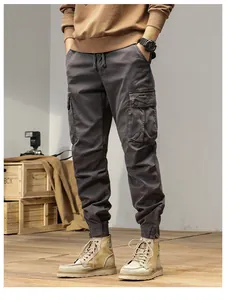 Vintage charcoal grey men's cargo jogger pants with multiple utility pockets and drawstring