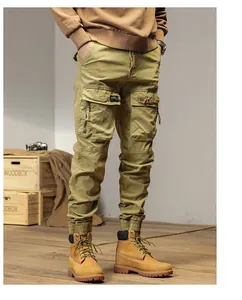 Close-up of men's khaki cargo pants featuring multi-pockets and elastic cuffed hems