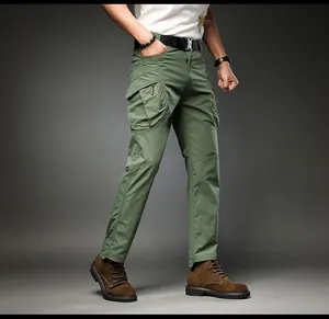 Side view of men's green cargo pants with functional multi-pockets and a tapered fit.