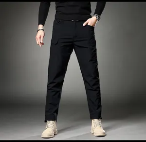 Professional studio shot of men's slim-fit straight-leg cargo pants in black worn by a model