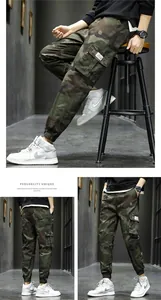 Detail view of men's camouflage cargo pants with streetwear jogger design and multi-pockets.