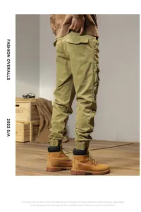 Back view of men's khaki vintage cargo pants with multi-pockets and elastic cuffs.