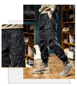 Close-up detail of men's black fleece-lined cargo pants in mountain retro style