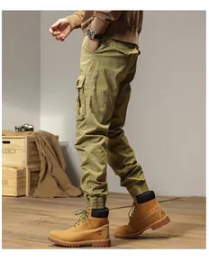 Detailed side view of olive green cargo pants featuring multi-pockets and elastic cuffs