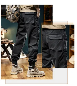Macro view showing the back pocket detail of men's vintage black fleece cargo pants