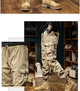 Detailed view of men's vintage khaki cargo jogger pants and tan leather boots in a rustic room.