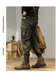 Detailed side view of olive green men's vintage jogger cargo pants with multiple pockets