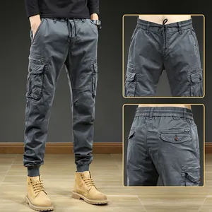 Men's vintage grey cargo jogger pants with multiple pockets and elastic waist.