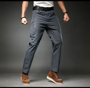 Detailed shot of grey men's multi-pocket tactical cargo pants with stretch fabric