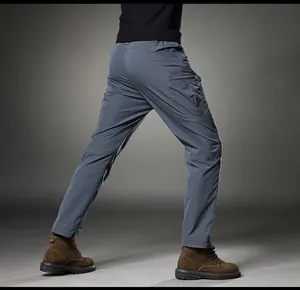 Side view of men's slim fit retro straight cargo pants in grey with side pockets