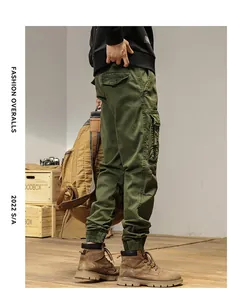 Side view of men's olive green cargo pants with multi-pockets and cuffed hems
