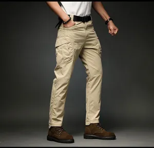 Detailed full-length view of men's khaki cargo pants with multiple utility pockets and belt