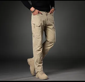 Detail view of men's slim fit khaki cargo pants featuring multiple utility pockets and stretch
