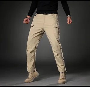 Men's khaki cargo pants with multi-pocket design and tactical style boots context