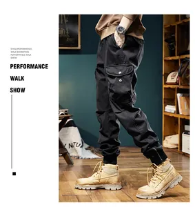 Professional side view of men's vintage black cargo jogger pants with large utility pockets