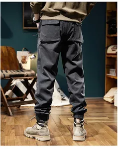 Rear view of men's vintage dark grey fleece-lined cargo joggers with elastic cuffs