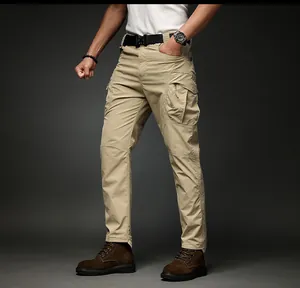 Detailed view of men's khaki cargo pants with multi-pockets and side zippers