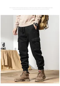 Close-up detail of men's fleece-lined retro loose cargo pants with pockets in black color