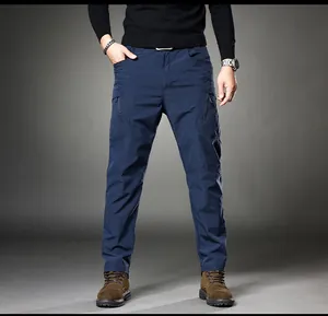 Macro detail of side zipper pockets on navy blue men's vintage tactical cargo pants