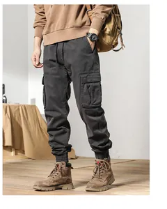 Full-length view of men's dark grey fleece-lined jogger cargo pants with multiple pockets