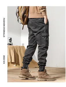 Side view detail of men's dark grey thick fleece retro cargo pants with multiple pockets
