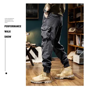 Detail view of men's heavy fleece-lined cargo jogger pants in charcoal grey retro style