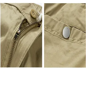 Detail shot of khaki cargo shorts showing zipper fly and pocket snap button.
