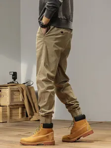 Minimalist khaki cargo pants for men featuring elastic cuffs and a retro Japanese street style