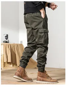 Side view of olive green men's cargo pants with large side pocket and cuffed hem
