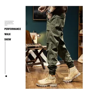 Close-up of men's olive green cargo pants with elasticated cuffs and large pockets