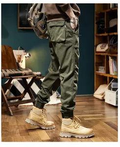Side view of olive green cargo pants with elastic cuffs and large side pockets detail.