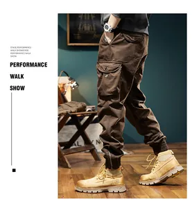 Detail view of men's brown vintage cargo joggers with functional multi-pocket design
