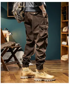 Side view detail of men's vintage brown fleece cargo joggers with elastic cuffs