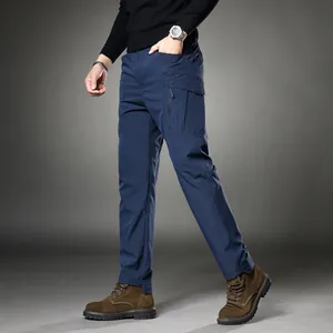 Men's tactical navy blue cargo pants with multiple utility pockets and relaxed casual fit