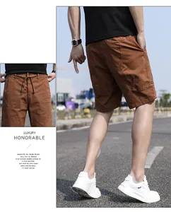 Men's vintage brown cargo shorts detail view showing fabric texture and drawstring waist